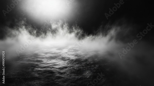 Black and white background with misty fog and a light source.