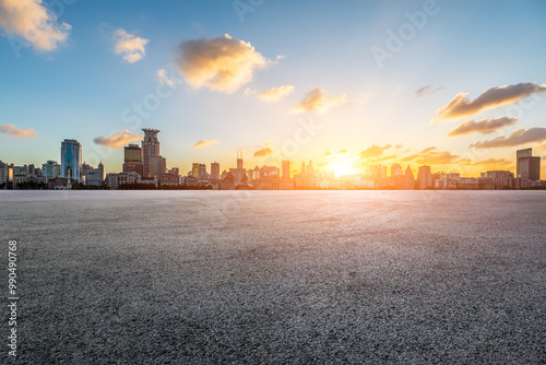 Asphalt road square and modern urban buildings scenery at sunset in Shanghai. car advertising background.