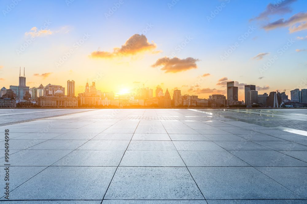 Empty square floor and city skyline with modern buildings scenery at sunset in Shanghai. Famous Bund landmark in China. Empty square floor and city skyline with modern buildings scenery at sunset in Shanghai. Famous Bund landmark in China.
