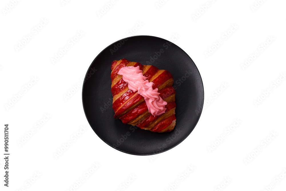 Fototapeta premium Crispy fresh red croissant with cream and strawberries