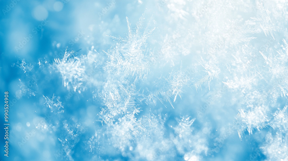 Delicate snowflakes gently fall against a bright blue winter sky in a serene outdoor landscape Delicate snowflakes gently fall against a bright blue winter sky in a serene outdoor landscape