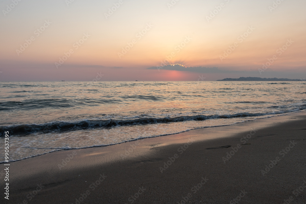 Sunset at beach over the Adriatic sea near the city of Dürres in Albania, which is a port city in western Albania, west of the capital, Tirana and known for its huge Roman amphitheatre Sunset at beach over the Adriatic sea near the city of Dürres in Albania, which is a port city in western Albania, west of the capital, Tirana and known for its huge Roman amphitheatre