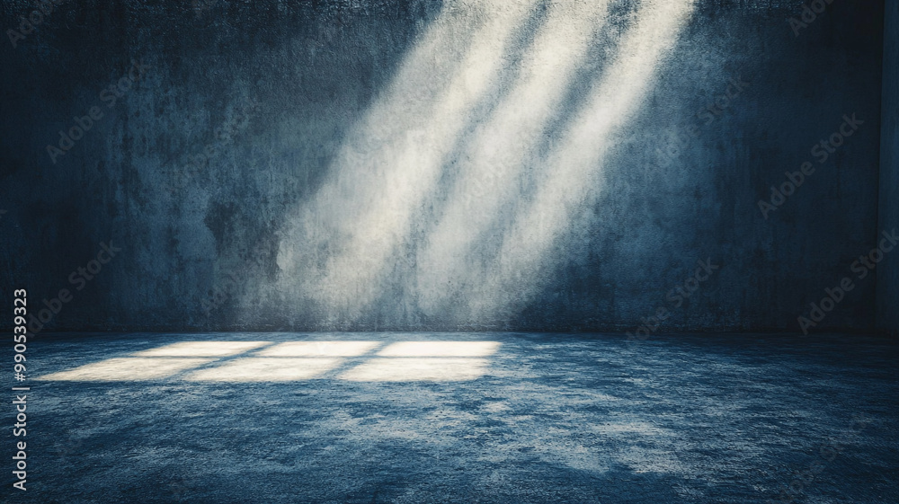 Soft light rays illuminate an empty, textured room with dark walls during the early morning hours Soft light rays illuminate an empty, textured room with dark walls during the early morning hours