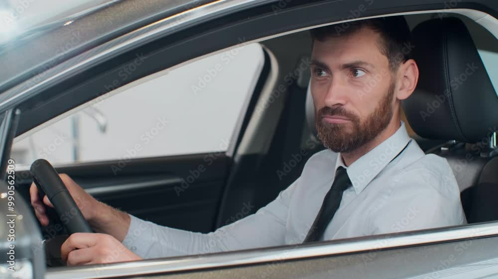 Young man sitting inside car is very upset and stressed. Young man sitting inside car is very upset and stressed.