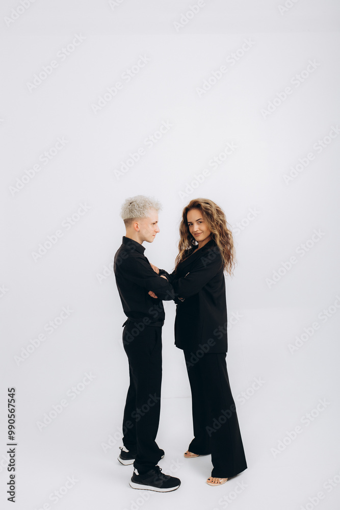 a dancing couple of social dance teachers in a black suit on a white background a dancing couple of social dance teachers in a black suit on a white background