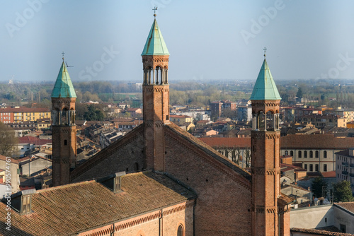 Cremona panorama of the cathedral bell tower from the Torrazzo tower at sunset. High quality photo photo