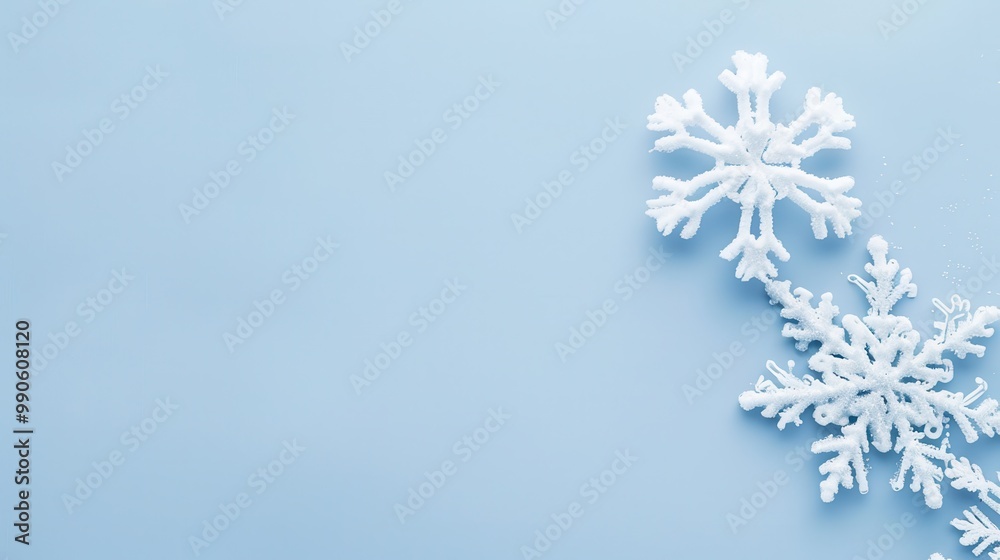 Minimalist banner, soft blue background, two snowflakes side by side, clean copy space above and below. Minimalist banner, soft blue background, two snowflakes side by side, clean copy space above and below.
