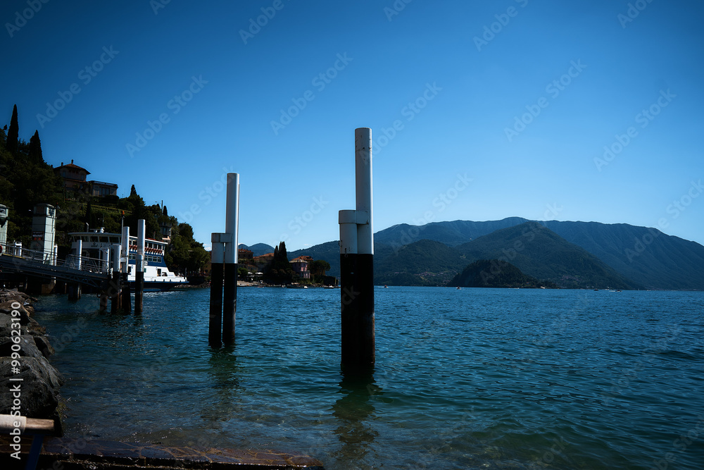 pillars in the water on the shore of Lake Como pillars in the water on the shore of Lake Como