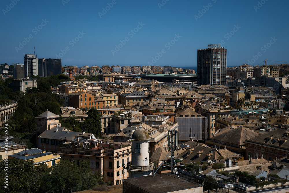 roofs of houses in Genoa with a view of the sea on a sunny day roofs of houses in Genoa with a view of the sea on a sunny day
