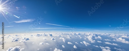 Aerial view of fluffy clouds under bright sunlight during daytime with clear blue sky above