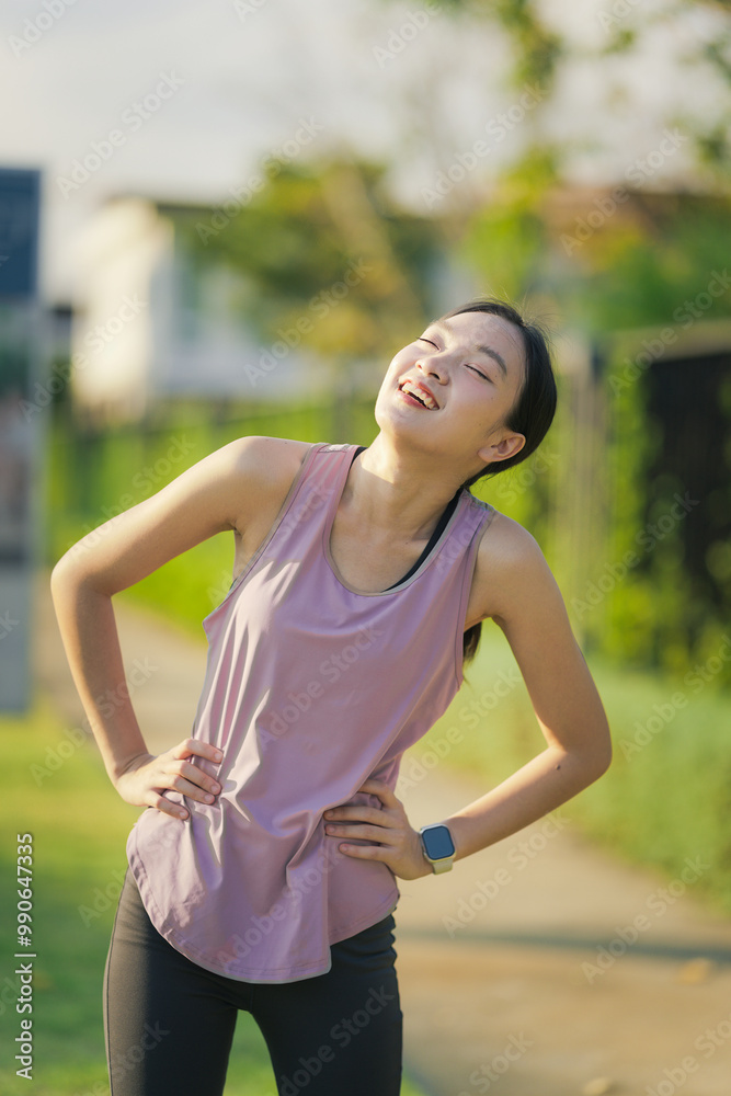 Asian girl exercising in the park. Fitness girl jogging for her own health. Asian girl exercising in the park. Fitness girl jogging for her own health.