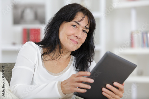 mature woman using tablet in the home