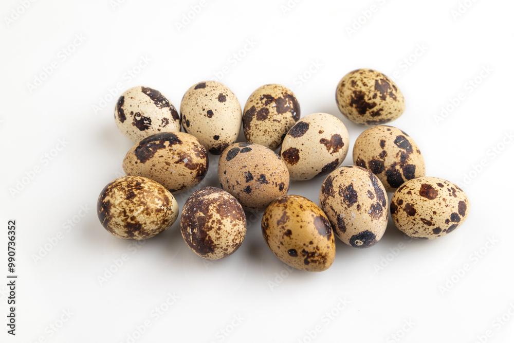 Fototapeta premium Pile of Raw Quail eggs isolated on white, side view