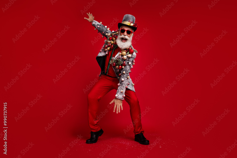 Photo of eccentric positive nice man wear stylish suit jacket summer glasses have fun party isolated on red color background Photo of eccentric positive nice man wear stylish suit jacket summer glasses have fun party isolated on red color background