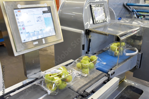 modern packaging machine for fresh pears in a factory for food industry