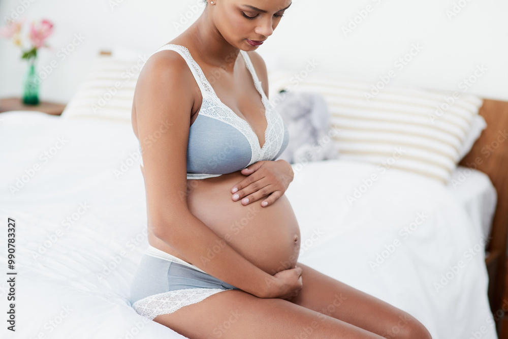 Pregnancy, woman and stomach care in bedroom with new mother love, support and underwear in morning. Bed, pregnant and relax with thinking, maternity wellness and belly with home, ideas and calm