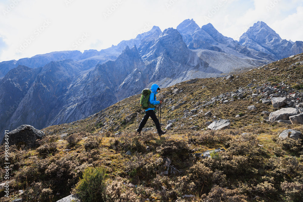 Woman hiking on high altitude mountains Woman hiking on high altitude mountains