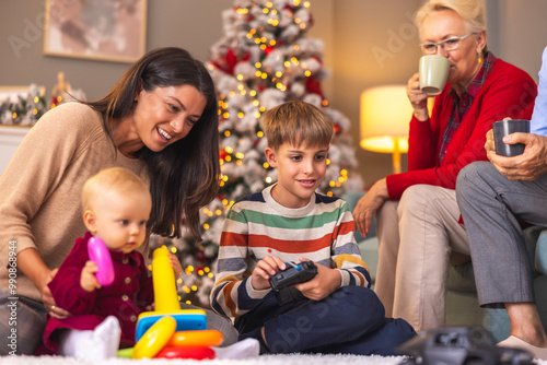 Children spending Christmas day at home with mother and grandparents