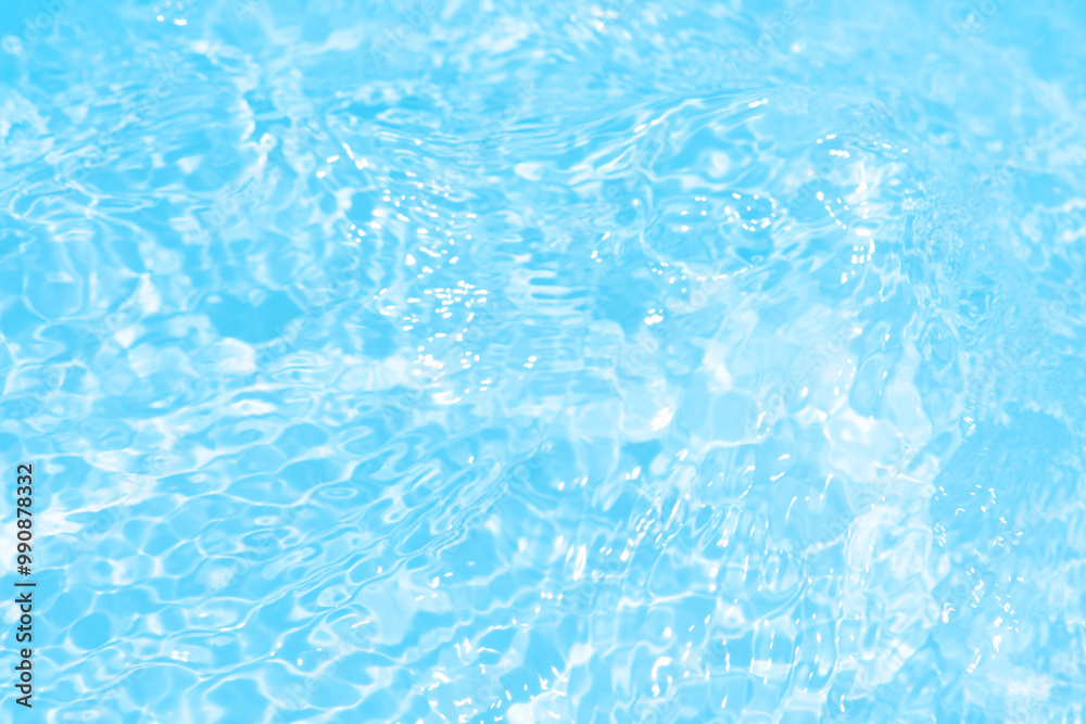 Blue water with ripples on the surface. Defocus blurred transparent blue colored clear calm water surface texture with splashes and bubbles. Water waves with shining pattern texture background. Blue water with ripples on the surface. Defocus blurred transparent blue colored clear calm water surface texture with splashes and bubbles. Water waves with shining pattern texture background.