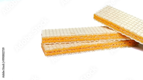 three layered wafers, with cheese paste, on an isolated white background photo