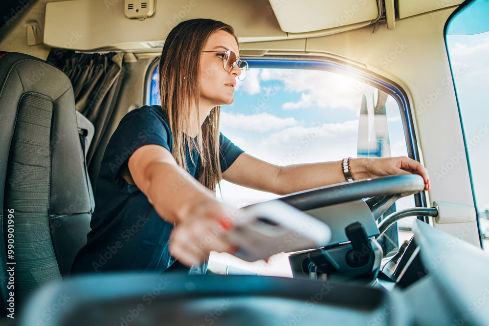 Φωτογραφία Portrait of beautiful young woman professional truck driver sitting and driving big truck