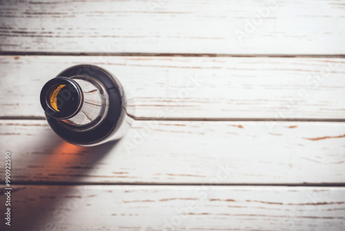 Beer bottle on an old white wooden table