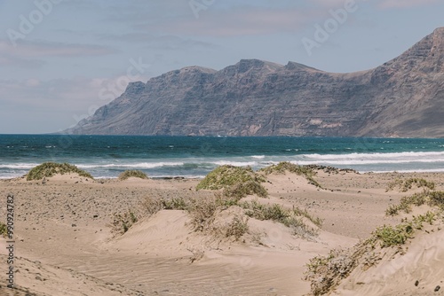 Vista de la playa de Famara y risco de fondo en la isla de Lanzarote  photo