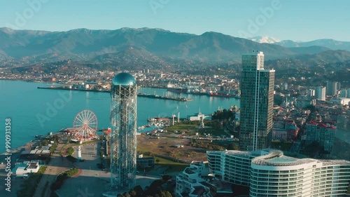 Aerial drone view of modern coastal city with high-rise buildings and sea port in background, Batumi, Geaorgia. Caucasus region photo