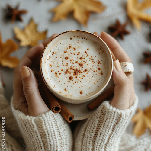 Autumn concept. First person top view shot of woman's hands in sweater holding cinnamon sticks aniseed sparkling drink on isolated beige background. Made with generative ai
