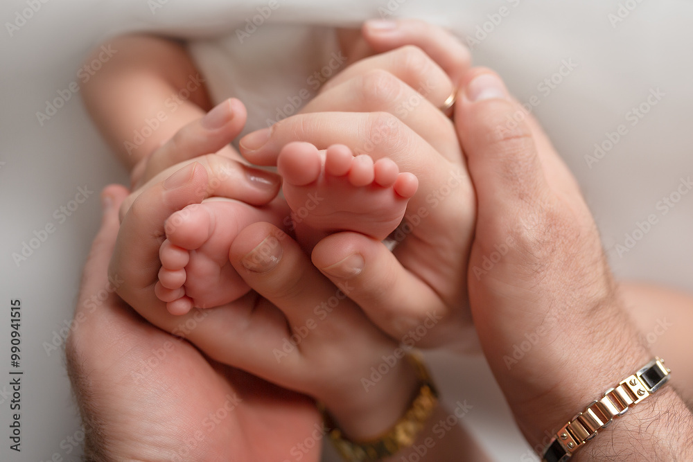 feet in parents hands on white background. newborn baby foot feet in parents hands on white background. newborn baby foot