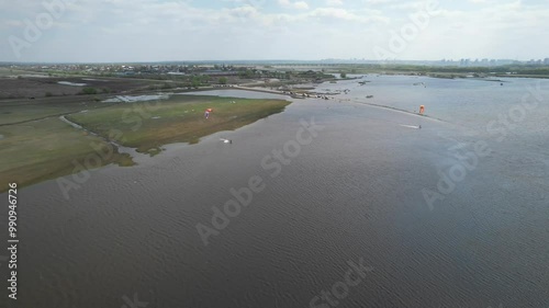 Spring floods, flooded road, sudden rise of water in the river, blocked passage. High altitude wide drone shot flooded area at spring time. High quality 4k footage