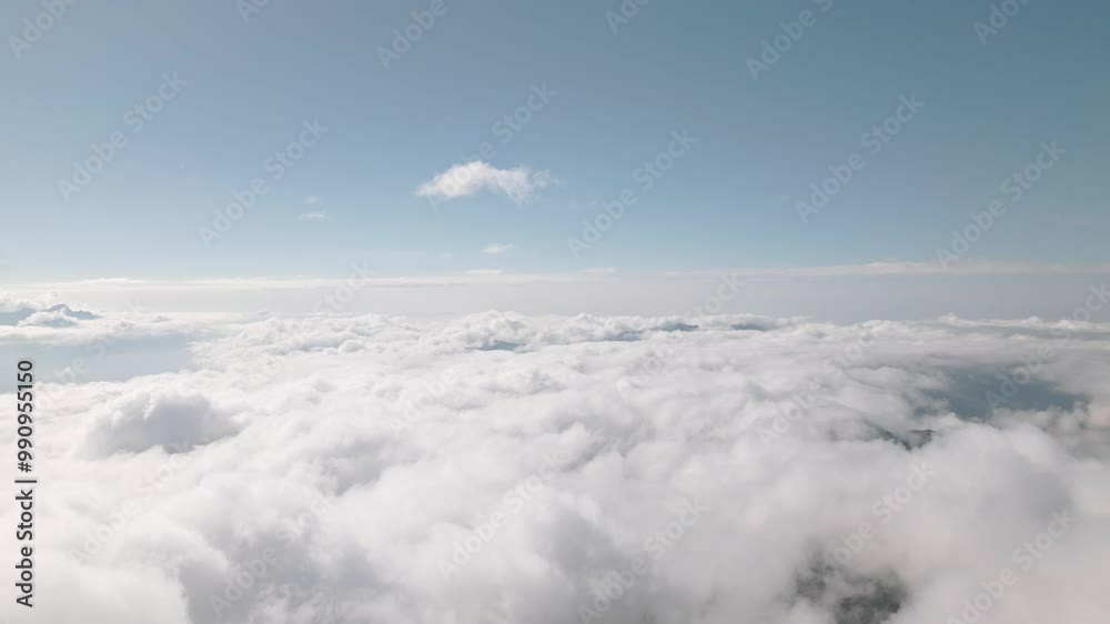 Flying fast motion Through the Soft Fluffy Clouds on High Altitude in the Mountains on a Sunny Day, Shot in 4K UHD Flying fast motion Through the Soft Fluffy Clouds on High Altitude in the Mountains on a Sunny Day, Shot in 4K UHD