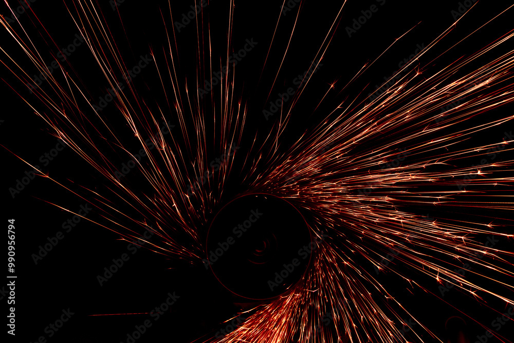 Obraz premium red sparks from the grinder glowing in the dark