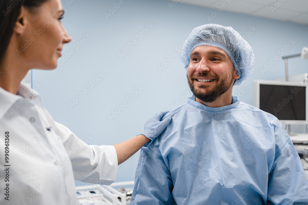 Close up of young female doctor gastroenterologist consults talks to male patient man in a modern medical private clinic cabinet before gastroduodenoscopy procedure. Gastroscopy endoscopy concept Close up of young female doctor gastroenterologist consults talks to male patient man in a modern medical private clinic cabinet before gastroduodenoscopy procedure. Gastroscopy endoscopy concept