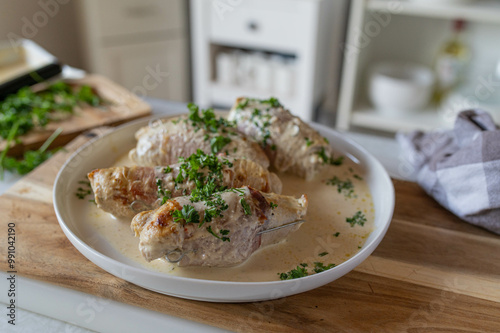 Delicious poultry roulades made with turkey breast. Filled with cream cheese and wrapped with parma ham. Served in a delicious cream sauce