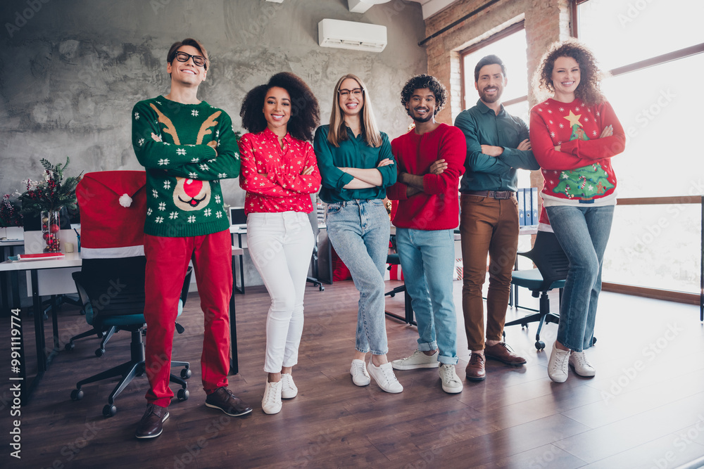 Full body photo of cheerful young people colleagues crossed hands posing cozy christmas party decor spacious office indoors Full body photo of cheerful young people colleagues crossed hands posing cozy christmas party decor spacious office indoors