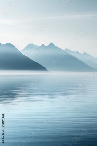 Serene Mountain Reflections: A minimalist landscape showcasing the ethereal beauty of a misty mountain range mirroring in a still lake, perfect for evoking tranquility, peace, and serenity. 