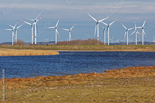 Wasserfläche im Hauke-Haien-Koog bei Ockholm in Nordfriesland Schleswig-Holstein, Deutschland mit Windrädern. Speicherbecken Süd. photo