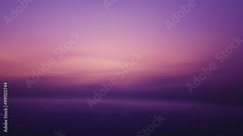 The sky is turning from pink to purple as the sun sets below the horizon, creating a soft gradient of colors across the sky