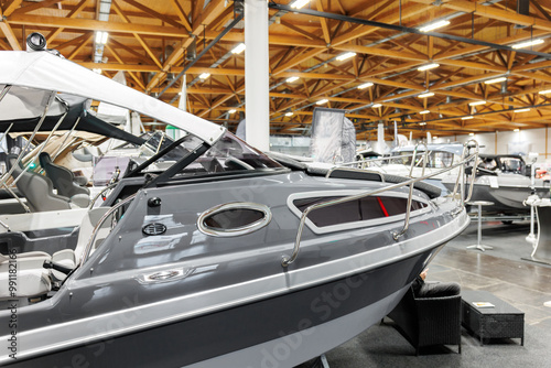 Many small big ship yachts at boat show exhibition indoors hall. Marine fishing yachting sailing vessel expo commercial trading business. Modern recreation sport water transport fair