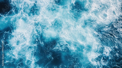 Aerial view of the choppy blue ocean with frothy waves Captured from above in a vast marine environment