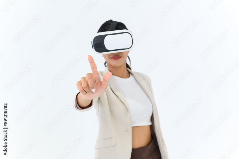 business woman in informal suit wearing VR goggles pointing in the air while standing isolated on white background. concept of Metaverse, virtual reality, future, technology, and internet of things. business woman in informal suit wearing VR goggles pointing in the air while standing isolated on white background. concept of Metaverse, virtual reality, future, technology, and internet of things.