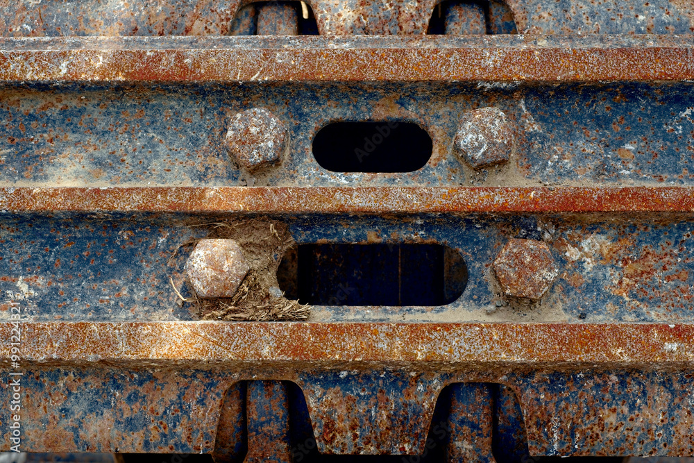 Detail of the track pad on a road work excavator Detail of the track pad on a road work excavator