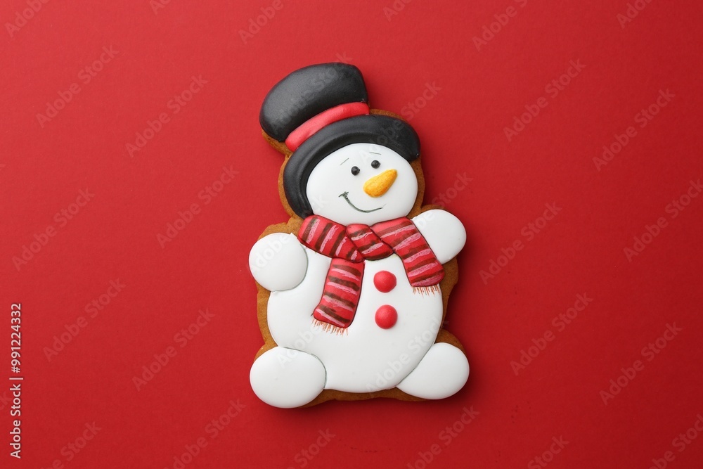 Tasty Christmas cookie in shape of snowman on red background, top view Tasty Christmas cookie in shape of snowman on red background, top view
