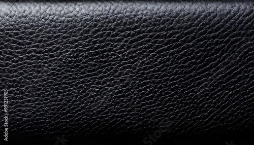 Textured black leather with visible fine grain details photo