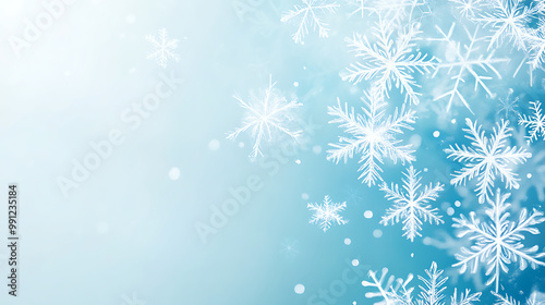 Minimalistic Christmas background with a gradient of icy blues and white snowflakes