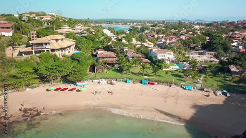 Aerial view of Ferradurinha Beach with houses and green hills, Búzios, Rio de Janeiro. photo