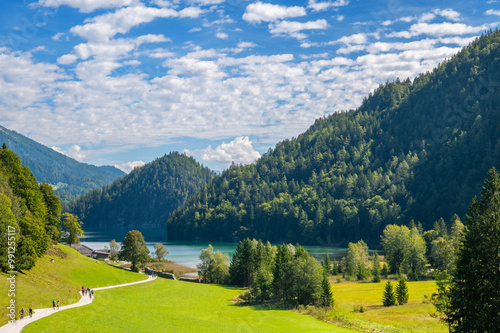 Hiking in Kaisergebirge Mountains at the Austrian Alps and around Lake Hintersteiner See. Village Hinterstein, Wilder Kaiser Austrian national park, Scheffau, Tirol, Austria. Nature landscape.  photo