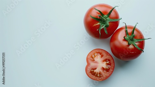 A top view of ripe tomatoes on a white table highlights their vibrant red color and fresh, organic appeal, making them perfect for vegetarian dishes and healthy recipe ideas.