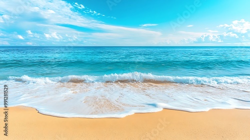 Peaceful beach with soft sand and blue ocean waves under a bright sunny sky, perfect for a summer getaway.